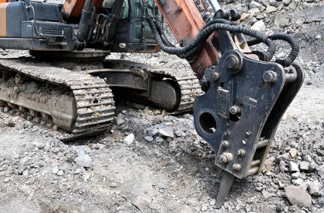 Excavator undercarriage carrying hydraulic breaker